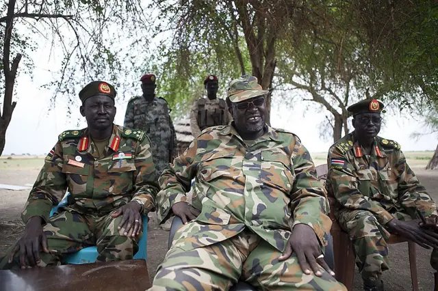 South Sudanese rebel leader and former vice president Riek Machar (C) sits in an army barracks in South Sudan's Upper Nile State on April 14, 2014