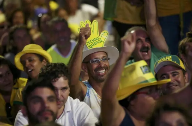 Brazilians in favor of the impeachment of President Dilma Rousseff react while watching the televised voting of the Lower House of Congress over her impeachment in Brasilia, Brazil April 17, 2016.