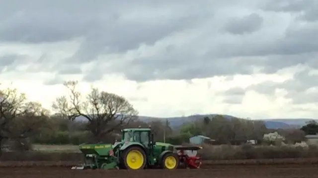 Tractor in field in Chelford