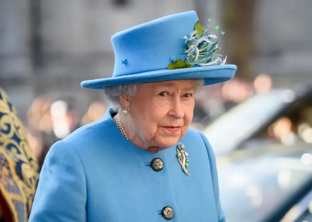 Queen Elizabeth II, in blue