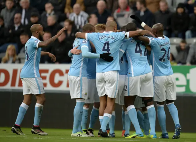 Man City celebrate after Sergio Aguero's opener