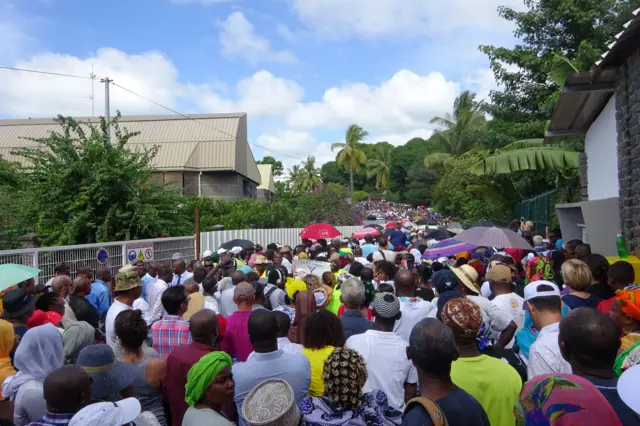 People take part in a march on April 19, 2016 in Mamoutzou to denounce violence and insecurity in the island, as part of a citizen mobilization called 'Ile Morte' (Dead Island). The march was called in response to the April 15 killing of a man by unknown attackers while on his way to collect his children.