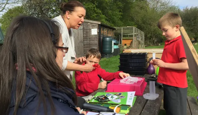 Pupils at Chadlington Primary School prepare their galactic seeds for sowing