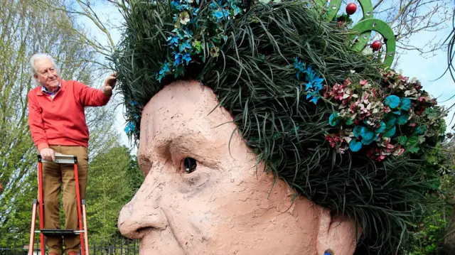 Ben Bennett inspecting the terracotta head