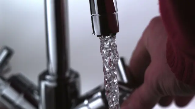 Hand turning on tap