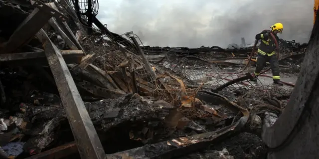 firefighters working at the Sony Distribution Centre in Enfield North London