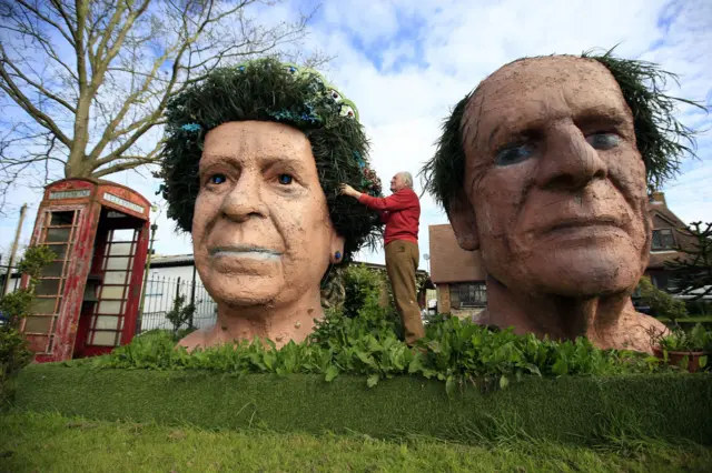 Two terracotta heads of the Queen and Duke of Edinburgh