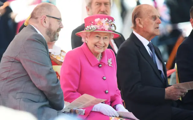 The Queen listening to school children singing for her