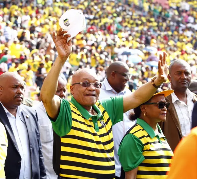 South African president and African National Congress (ANC)"s president Jacob Zuma (C) waves at supporters as he arrives for the Party official launch of the Municipal Elections manifesto on April 16, 2016 in Port Elizabeth, South Africa