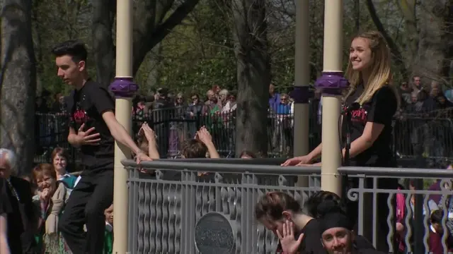 Students performing for the Queen