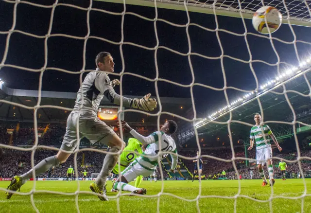 Ajax striker Arkadiusz Milik scores his side's equaliser at Celtic Park before the Dutch won their Europa League match 2-1