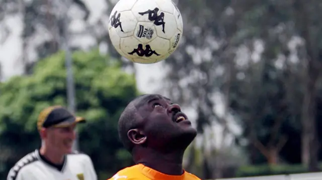 President Pierre Nkurunziza heading a football