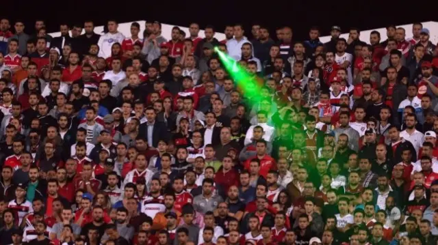 A laser beam being used by a Tunisian football fan in Sousse