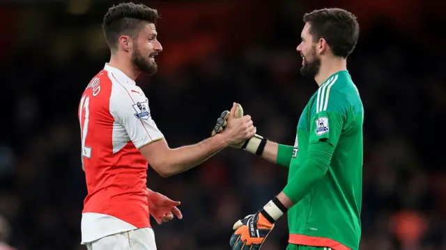 Olivier Giroud shakes hands with West Bromwich Albion goalkeeper Ben Foster