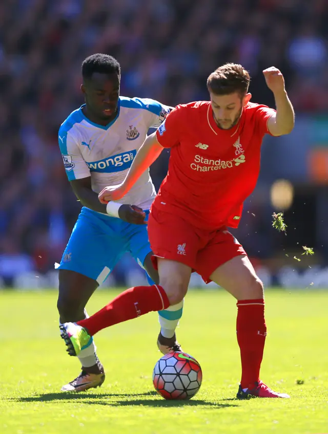 Cheik Tiote of Newcastle and Adam Lallana of Liverpool