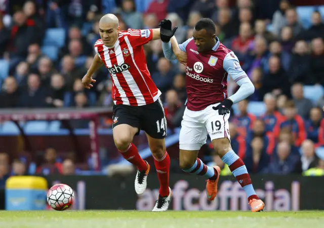 Jordan Ayew in action with Oriol Romeu