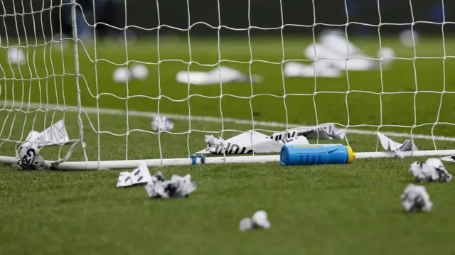 Paper planes litter the pitch