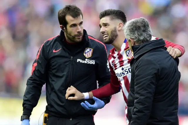 Yannick Carrasco is helped by assistants