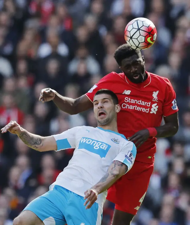 Aleksandar Mitrovic of Newcastle and Kolo Toure of Liverpool