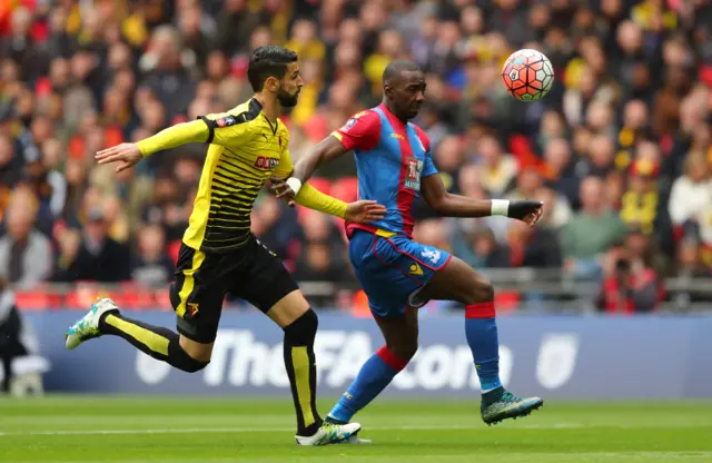 Yannick Bolasie of Crystal Palace is chased by Miguel Angel Britos of Watford