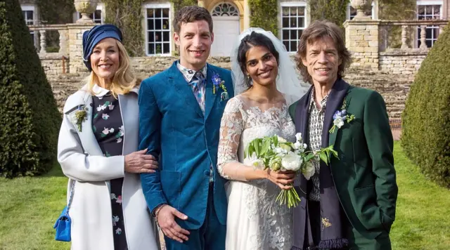 James Jagger and his wife Anoushka Sharma (centre) with Jerry Hall (left) and Mick Jagger (right) at their wedding celebration at Cornwell Manor, Chipping Norton