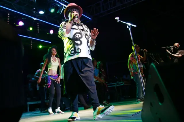 Congolese music star Papa Wemba performs onstage during the Femua music festival in Abidjan on April 24, 2016 before collapsing on stage