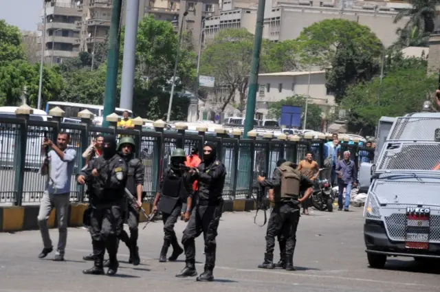 Egyptian Central Police Force fire tear gas canisters to disperse a protest in Giza Square, Giza, Egypt, 15 april 2016