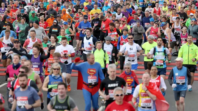 London Marathon runners cross the start line