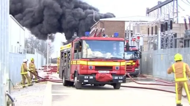 Fire engine and firefighters