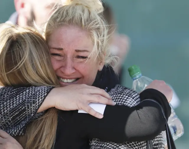 Families embrace after the Hillsborough inquests