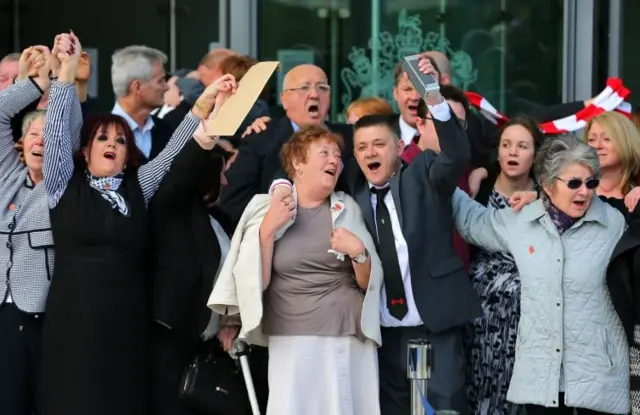 Singing outside court