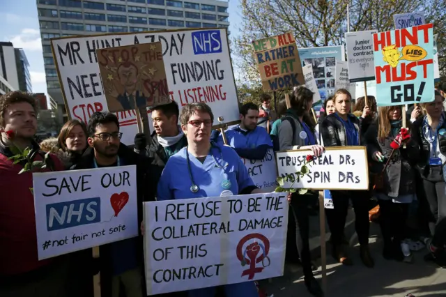 Doctors outside St Thomas' Hospital in London