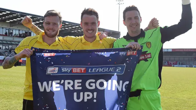 Brewers players celebrating last season's promotion