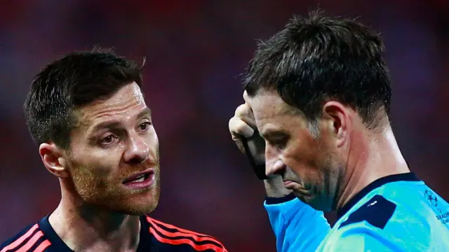 Xabi Alonso and Mark Clattenburg