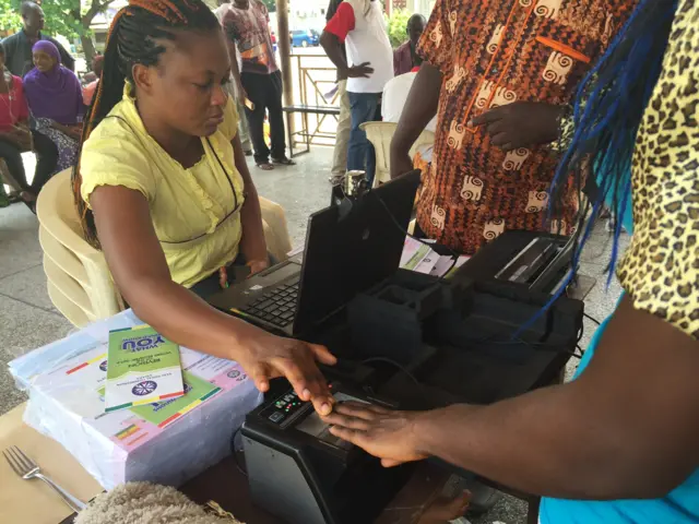 Voter registration machine being operated by an elctoral staff member