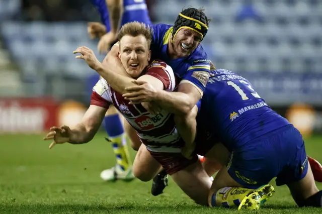 Dan Sarginson tackled by Chris Hill and Ben Westwood