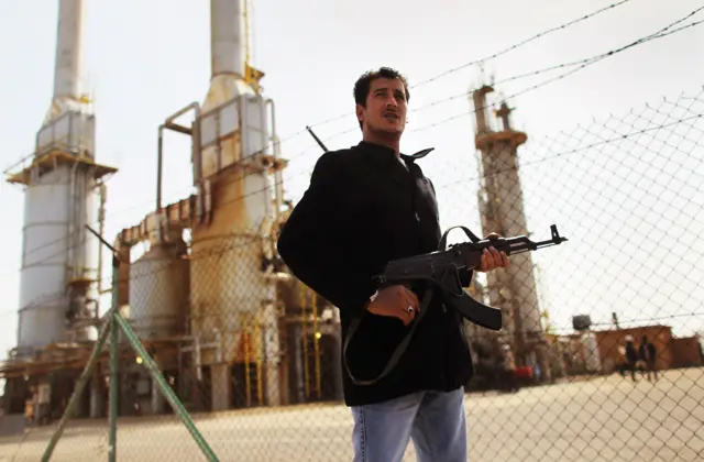 A gunmen in Libya at an eastern oil facility - 2011