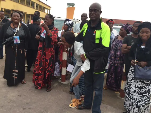 Mourners break down as the body of Papa Wemba arrives at the airport