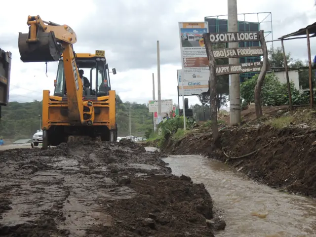 Digger trying to clean up the mud in Nairobi