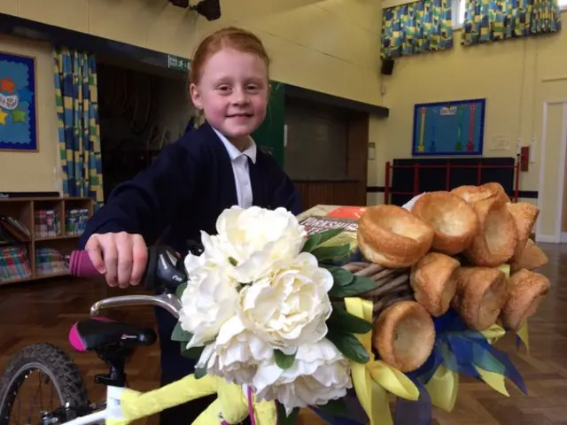 Hallie from Cherry Burton standing with her Yorkshire themed bicycle