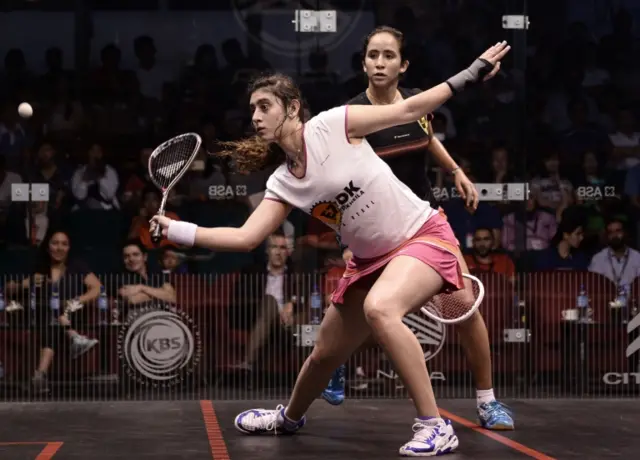 Nour El Sherbini of Egypt (L) plays a forehand against her compatriot Nouran Gohar (R) during their semi-final match