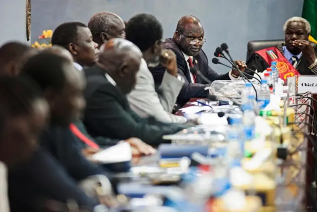 Riek Machar at the table