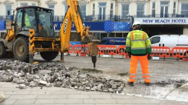 Work on the Marine Parade, showing digger and engineer