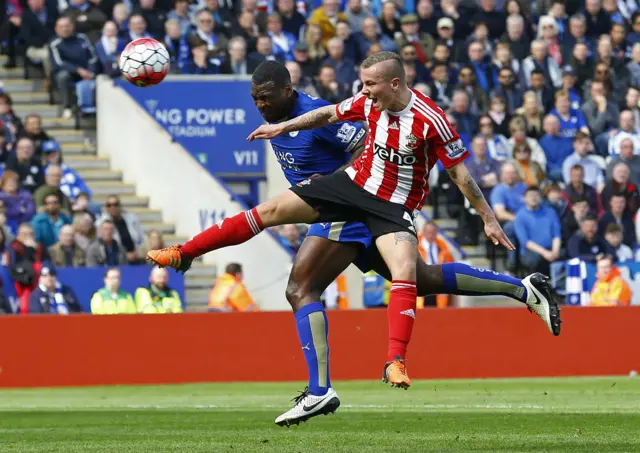 Wes Morgan heads at goal