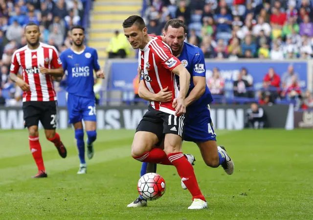 Danny Drinkwater holds onto Southampton's Dusan Tadic