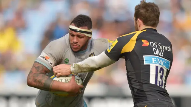 Northampton's Courtney Lawes breaks a tackle