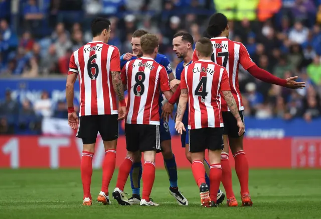 Jamie Vardy of Leicester City argues with Jose Fonte