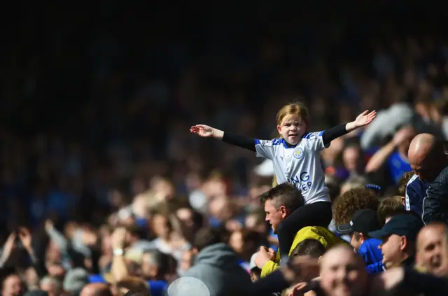 A Leicester fan in the stands celebrates