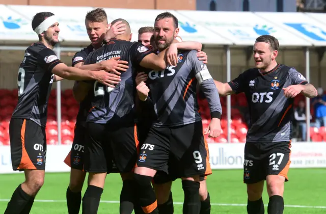 Kilmarnock players congratulate Kris Boyd following his penalty