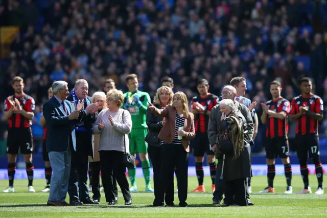 Relatives of Hillsborough victims on the pitch at Goodison